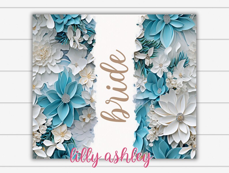 May include: A white background with the word "bride" written in brown script. The background is surrounded by a border of blue and white paper flowers.