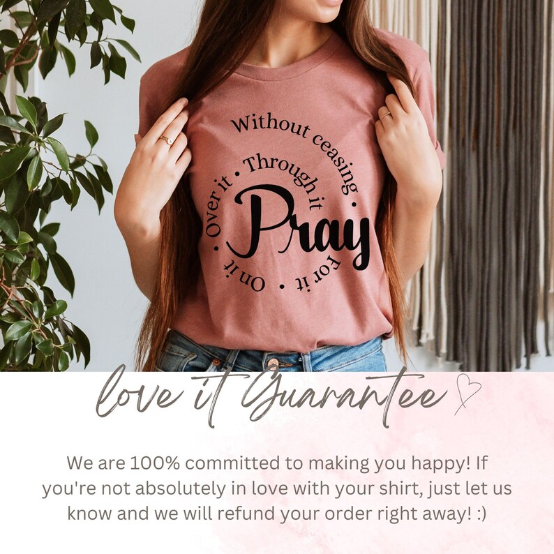 May include: A pink t-shirt with a black circle graphic that says "Without ceasing, Through it, Pray for it, On it, Over it". The text is in a cursive font. The shirt is being modeled by a person. The text "love it Guarantee" is at the bottom of the image.