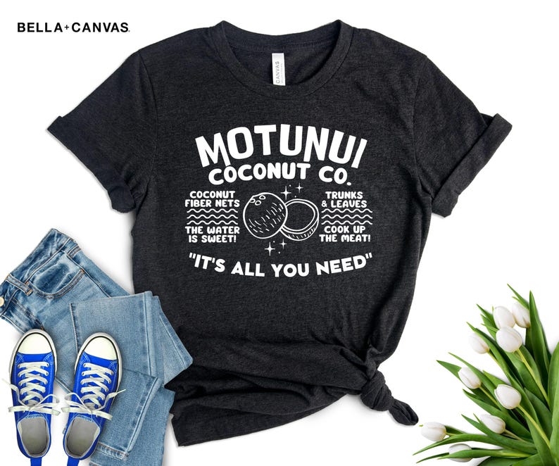 May include: A dark gray t-shirt with white text that reads "Motunui Coconut Co." and includes a graphic of coconuts. The text also says "Coconut fiber nets, the water is sweet! Trunks & leaves, cook up the meat!" and "It's all you need."