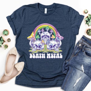 May include: A navy blue t-shirt with a graphic of colorful mushrooms and skulls with a rainbow above them. The text "Death Metal" is printed in a retro font below the graphic.