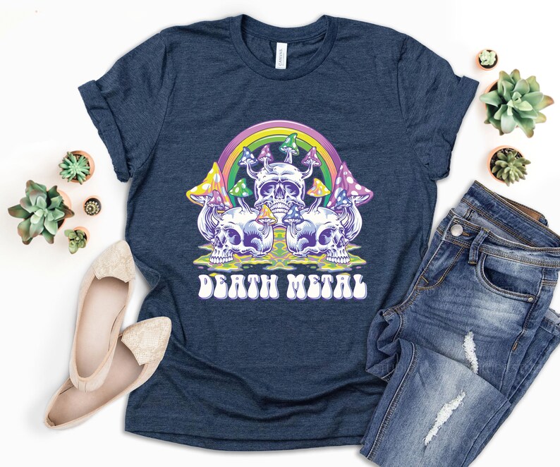 May include: A navy blue t-shirt with a graphic of colorful mushrooms and skulls with a rainbow above them. The text "Death Metal" is printed in a retro font below the graphic.