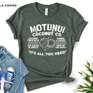 May include: A green t-shirt with white text that reads "Motunui Coconut Co." and "It's all you need". The text is surrounded by illustrations of coconuts and the words "Coconut fiber nets, the water is sweet!" and "Trunks & leaves, cook up the meat!"