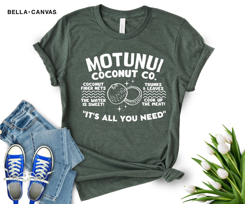 May include: A green t-shirt with white text that reads "Motunui Coconut Co." and "It's all you need". The text is surrounded by illustrations of coconuts and the words "Coconut fiber nets, the water is sweet!" and "Trunks & leaves, cook up the meat!"