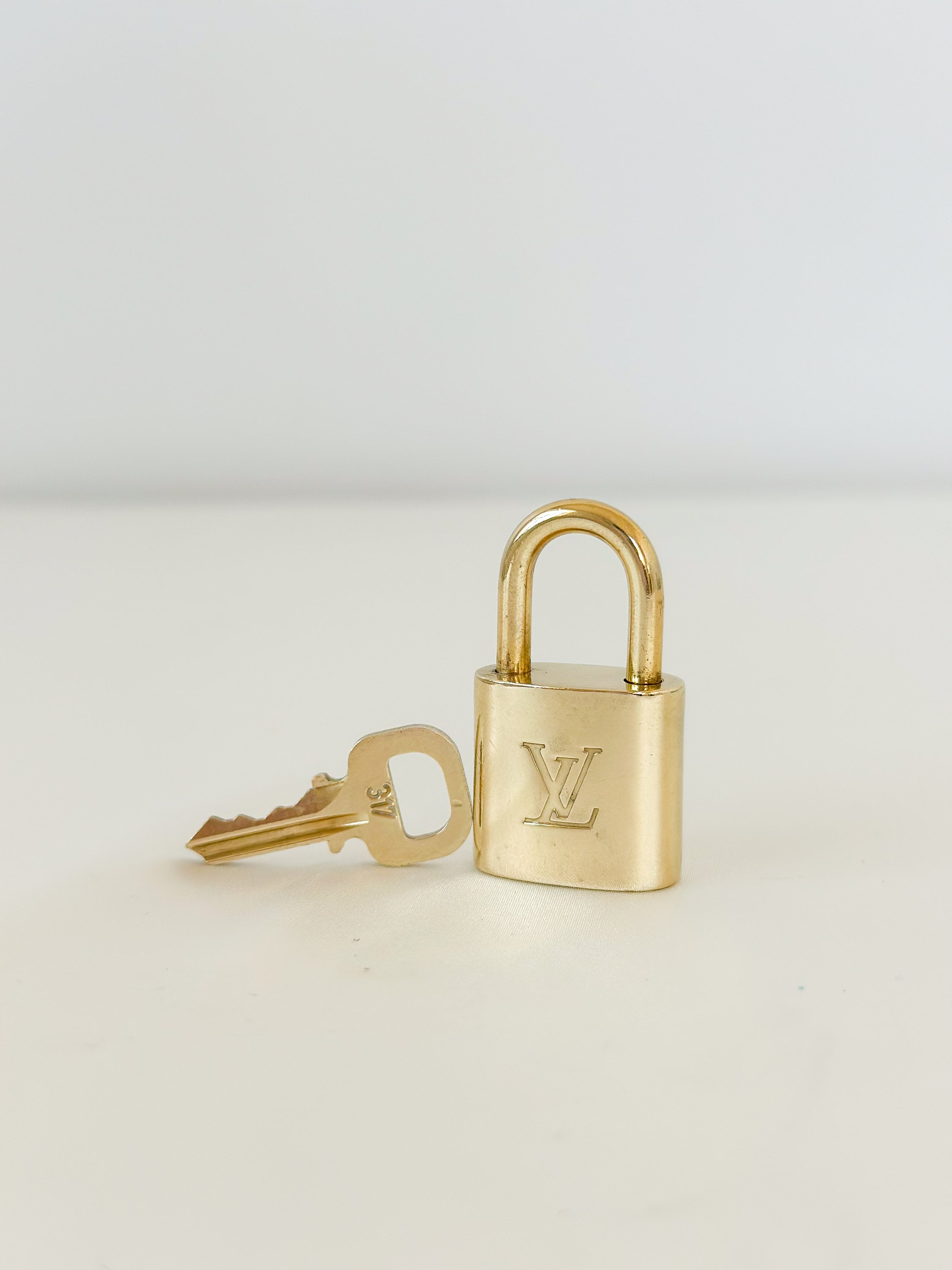 Louis Vuitton Vintage Bag Charm Padlock Key. On website search for