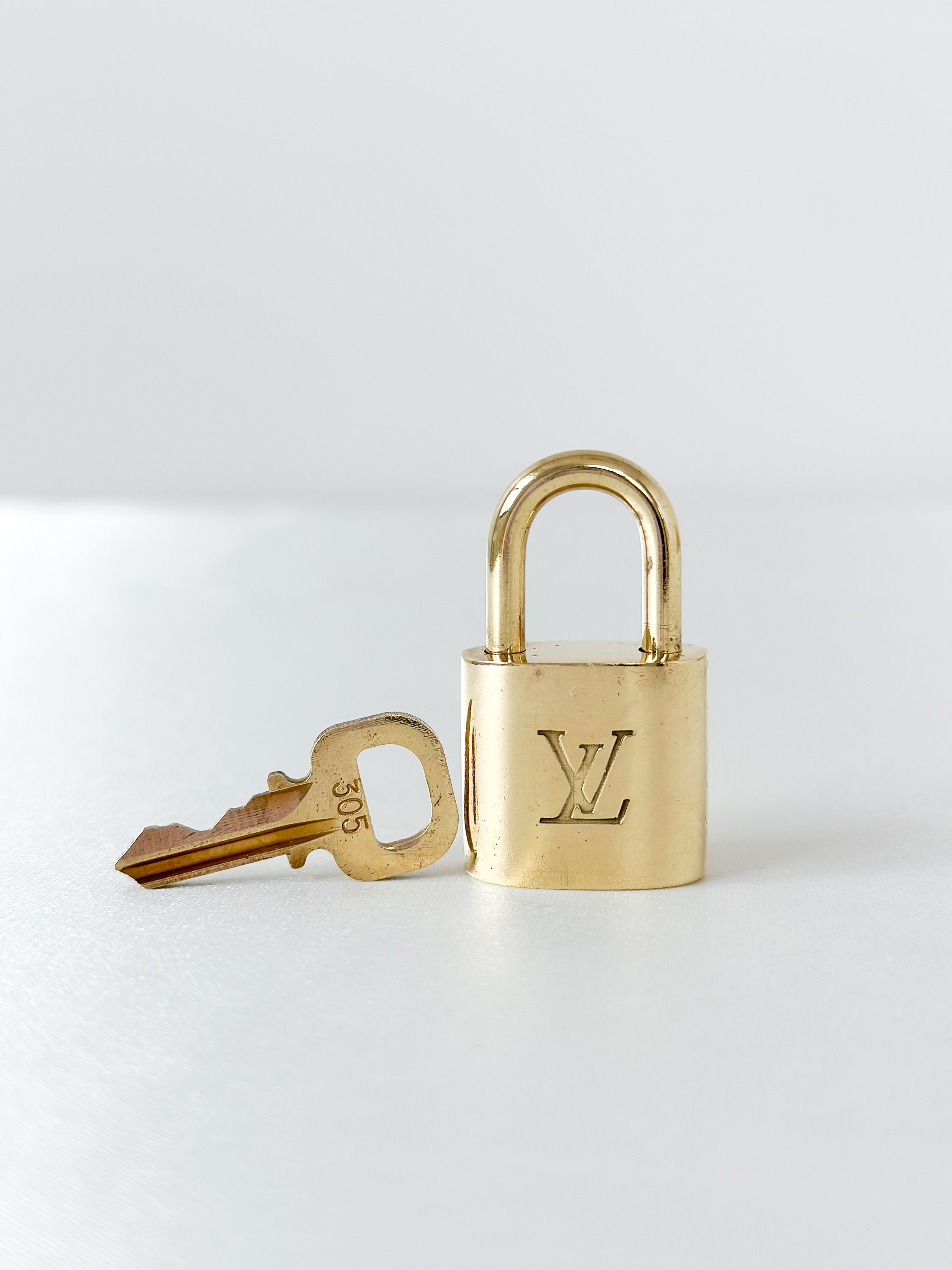 Louis Vuitton Clochette Lock & Key Set - Neutrals Bag Accessories