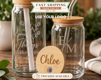May include: Two clear glass tumblers with bamboo lids and straws. One glass features a floral design with the text Good Things Take Time. The other glass shows the letters E M and the text D MOMENT. A separate bamboo lid is engraved with the name Chloe.