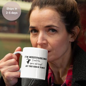 May include: White ceramic coffee mug with a black design that reads "I'm multitasking. I can listen, ignore and forget at the same time." A black goat silhouette is above the text.