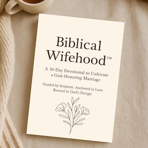 May include: A cream-coloured devotional book titled "Biblical Wifehood" with text and a floral illustration. The book is accompanied by a mug of tea and an open book on a neutral surface.