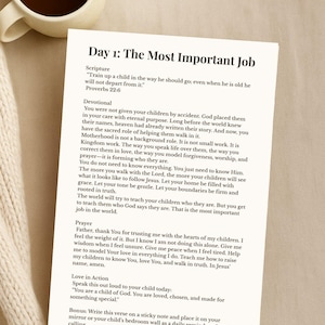 May include: A white paper with the title "Day 1: The Most Important Job" and text from Proverbs 22:6. The text describes the role of a parent. A cup of coffee sits in the upper left corner.