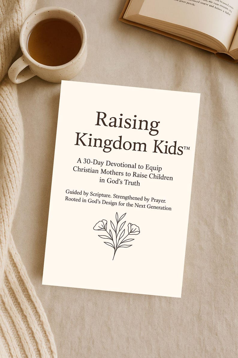 May include: A cream-colored book titled "Raising Kingdom Kids" with text describing a 30-day devotional for Christian mothers. A cup of tea and an open book are in the background. The book has a floral illustration.