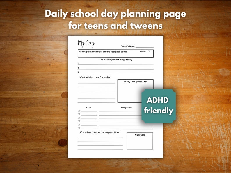 A single page planning page for teens is resting on a dark wooden desk. the planner has space to write out their daily plan, homework, gratitude, and reward.