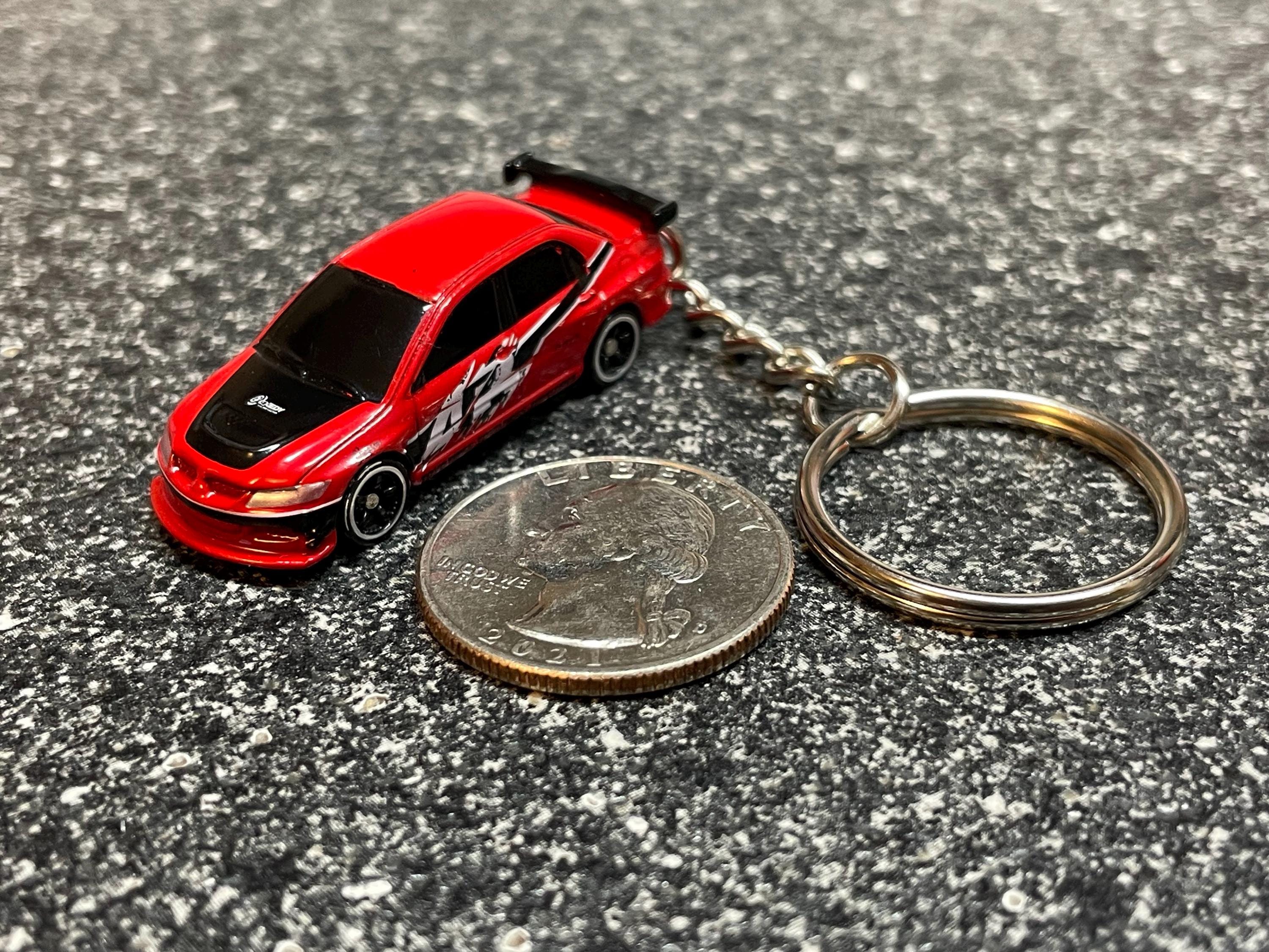 thumbnail interactive-video image 1 of Red Carbon Fiber Look 5 3/4" Lanyard Keychain Key Holder For Mitsubishi Lancer EVO 1 of 5