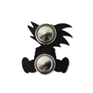 The back of an enamel pin with two locking backings.