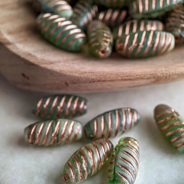 15pcs: Swirled Green with Copper Wash 14x7mm Spiral Oval, Oval with Grooves, Pressed Czech Glass Beads, Translucent Green, CG-SH-SPO14x7-1