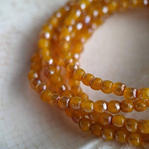 50pcs: Squash with Brown Sugar 3mm Round Druk, Czech Glass Beads in Orange, CG-P-R3-11