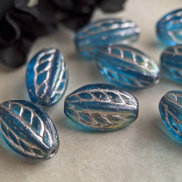 10pcs: Silvered Cerulean 15x9mm Rope Oval, Pressed Czech Glass Beads, Twisted Oval, Translucent Blue with Silver Wash, CG-SH-RPO15x9-1