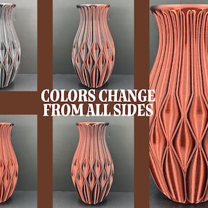 May include: A collection of decorative vases in various colors, including gray, black, and copper. The vases have a textured, geometric design and the text "COLORS CHANGE FROM ALL SIDES".