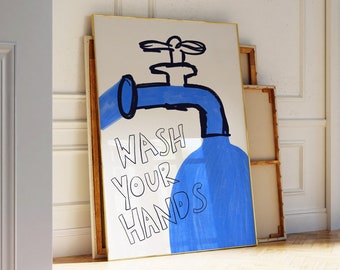 May include: A white framed poster with a blue faucet illustration and the text "WASH YOUR HANDS".