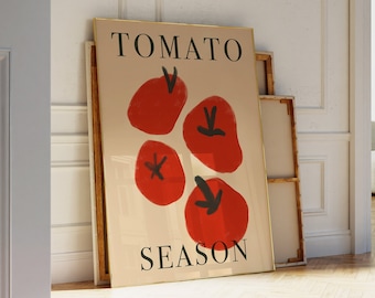 May include: A framed poster with the text "TOMATO SEASON" in black lettering on a beige background. The poster features a stylized illustration of four red tomatoes with black outlines.
