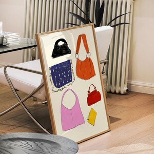 May include: A framed illustration features a collection of diverse handbags in various colors and styles.  A black handbag, a navy blue patterned bag, a bright orange bag, a pink tote bag, and a red satchel are depicted. A yellow accessory is also included. The artwork showcases a variety of handbag designs and color palettes.