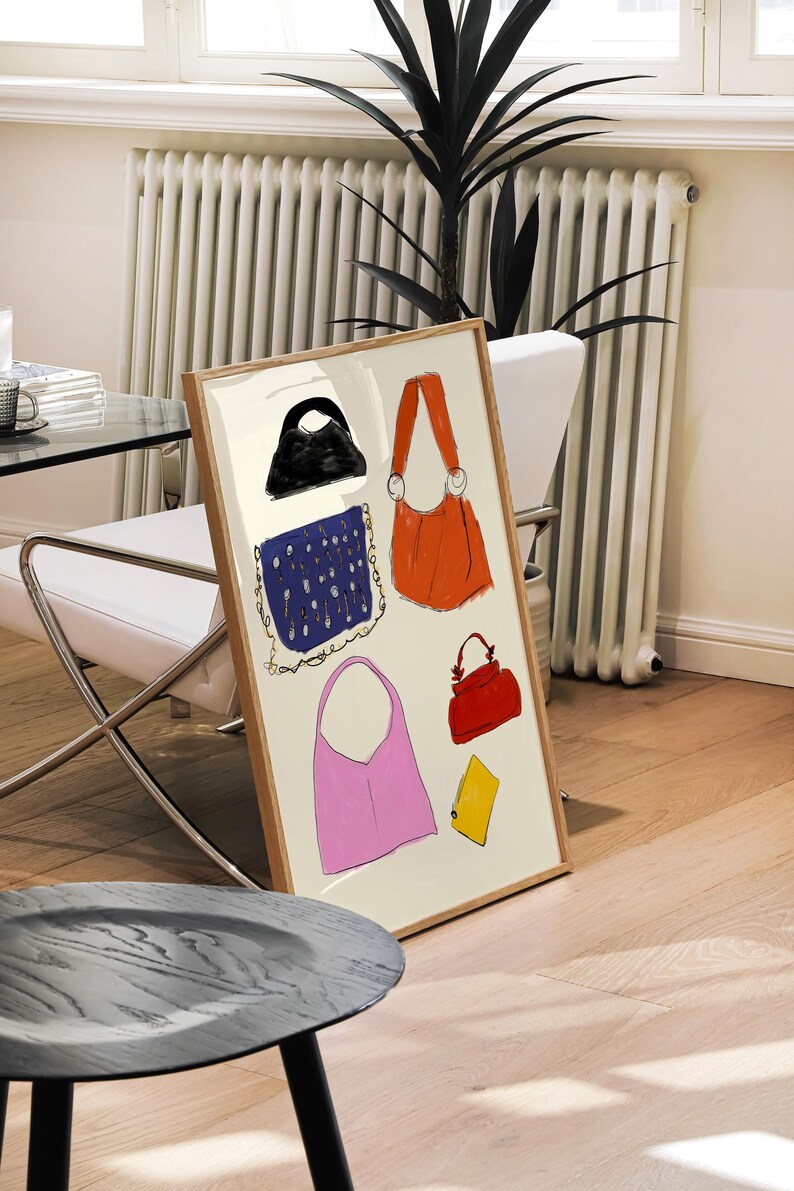 May include: A framed illustration features a collection of diverse handbags in various colors and styles.  A black handbag, a navy blue patterned bag, a bright orange bag, a pink tote bag, and a red satchel are depicted. A yellow accessory is also included. The artwork showcases a variety of handbag designs and color palettes.