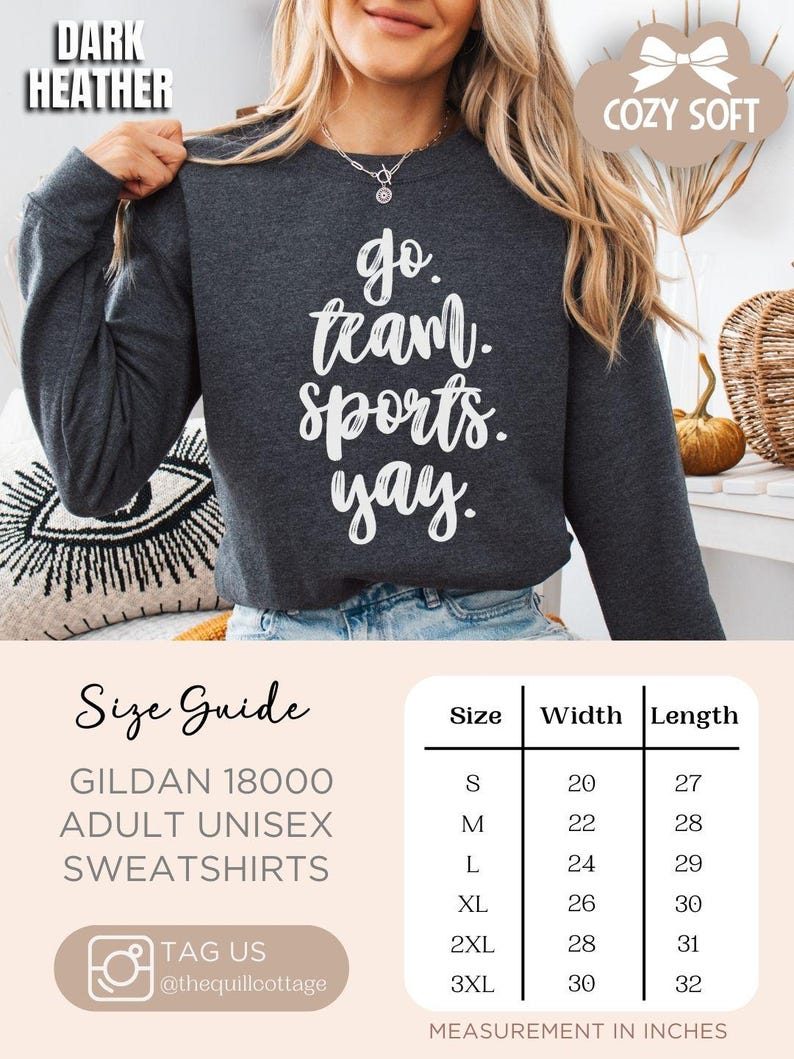May include: A dark heather gray sweatshirt with the text 'go team. sports. yay.' in white. The sweatshirt is a Gildan 18000 adult unisex sweatshirt. A size chart is shown with the sizes S, M, L, XL, 2XL, and 3XL, and the corresponding width and length measurements in inches.