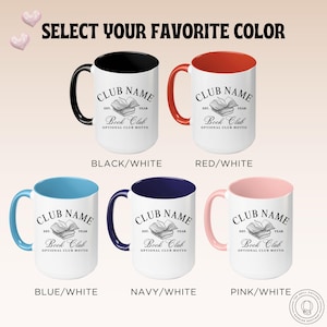 May include: White ceramic mugs with colored handles and interiors. Each mug features the text "CLUB NAME" above an open book graphic, with "Book Club" below. Available colors include black, red, blue, navy, and pink.