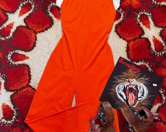 Orange 70-talsjumpsuit med utsvängda detaljer | Groovy Disco | Vintage