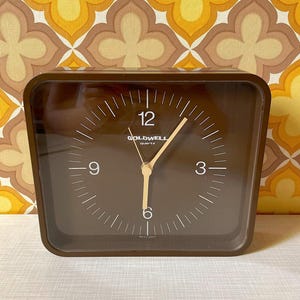 Goldwell Quartz Clock / Wall Clock made of plastic in brown | 70s | Mid Century | Vintage