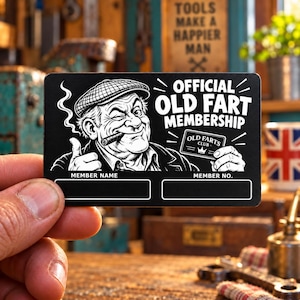 May include: A rectangular black card featuring a white graphic illustration of a winking person wearing a flat cap and smoking a cigar. The text reads OFFICIAL OLD FART MEMBERSHIP and OLD FARTS CLUB, with blank fields for MEMBER NAME and MEMBER NO.