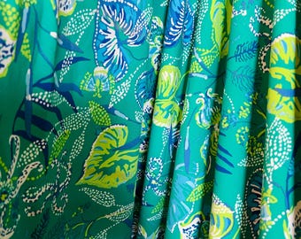 Teal Blue Green Leaves stretch spandex fabric lilly flowers soft stretchy knit great for making clothes swimwear yoga pants