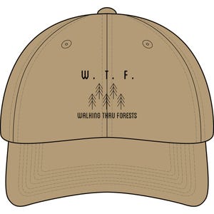 May include: A tan baseball cap with a curved brim. The cap features the text "W. T. F." above a graphic of stylized trees, with the words "WALKING THRU FORESTS" below the trees. The cap has a button on top.