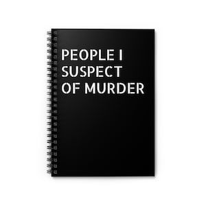 May include: Black spiral-bound notebook with the text "PEOPLE I SUSPECT OF MURDER" in white stencil-style letters. The notebook has a black cover and a silver spiral binding.