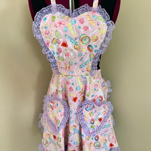 May include: A rustic wooden sign with the text "Welcome to our home" in white lettering. The sign features a distressed finish and a simple, inviting design, perfect for front door decor.