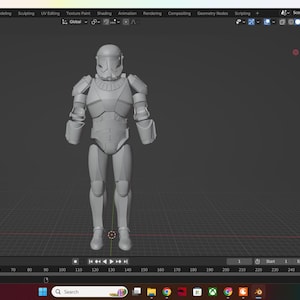 May include: A gray 3D model of a Star Wars clone trooper in a standing pose. The model is detailed with armor and weapons.