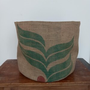 May include: A rustic wooden sign with the text "Welcome to our home" in white lettering. The sign features a distressed finish and a simple, inviting design, perfect for front door decor.