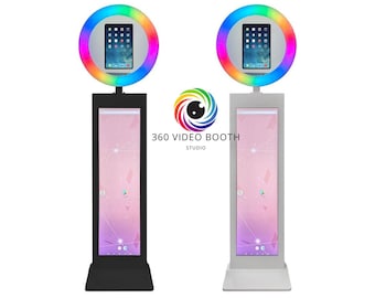 May include: Two 360 degree video booths, one with a black stand and one with a white stand. Both booths have a tablet mounted on a ring light with rainbow coloured LEDs.
