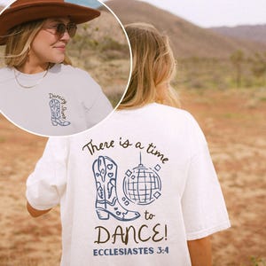 May include: White t-shirt with a blue graphic of a cowboy boot, a disco ball, and the text "There is a time to DANCE!" and "Ecclesiastes 3:4". The front of the shirt has the text "Dancing Shoes" and a cowboy boot graphic.