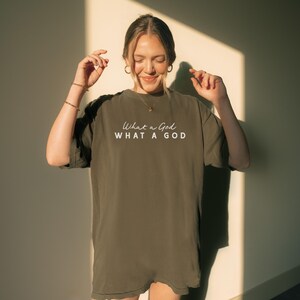 Oversized Christian Tshirt Women Faith Based Praise Team Apparel Church Outfit Sunday Service What a God Inspirational Design Worship Shirt Comfort Colors Premium Quality Soft Washed Garment Dyed Relaxed Fit Vintage Feel Neutral Tones