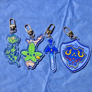 The Legend of Zelda-sleutelhanger / Hylian-schild Korok Hyrule-plant Mastersword / Loz-bedel