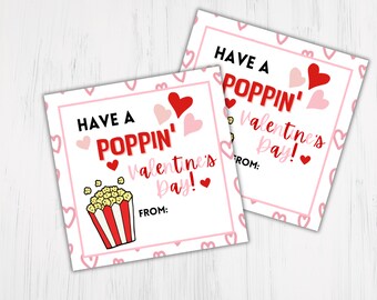 May include: Two printable Valentine's Day gift tags with a popcorn bucket and the text "Have a Poppin' Valentine's Day!" with pink hearts on a white background.