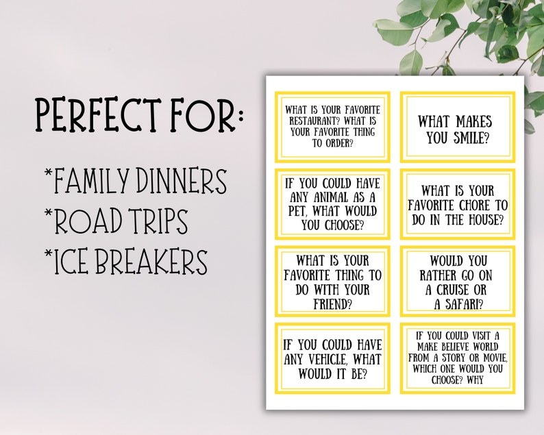 May include: A white card with yellow-bordered question prompts for family dinners, road trips, and ice breakers. Questions include favorite restaurant, pet choice, and what makes you smile.