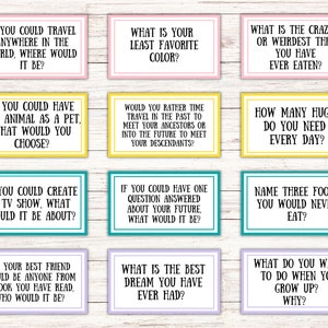 May include: Nine colorful cards with questions like "If you could travel anywhere in the world, where would it be?" and "What is your least favorite color?" The cards have white text on various colored backgrounds.