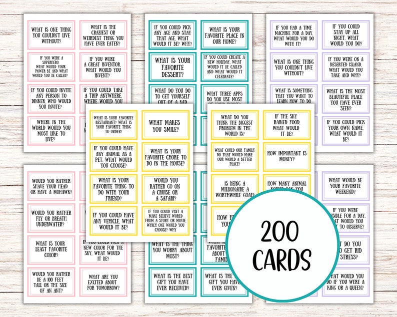 May include: A set of 200 conversation starter cards with various questions printed on them. The cards are rectangular with a white background and colorful borders. A circular graphic reads "200 CARDS".