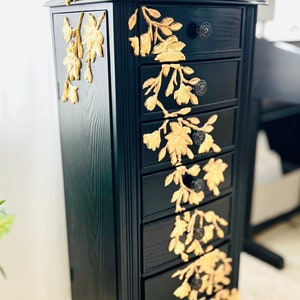 Jewelry Armoire with gold leaf sculpted lilies