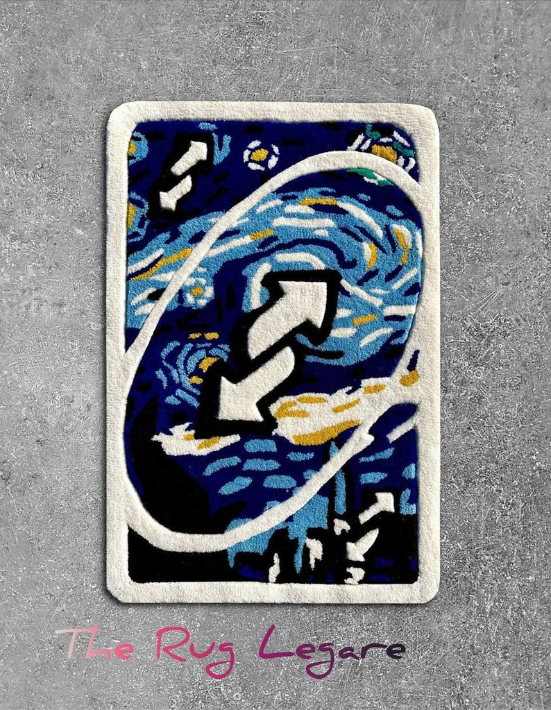 May include: A rectangular rug featuring a stylized design of an Uno reverse card, with a blue and white swirling pattern reminiscent of Van Gogh's "Starry Night." The rug has a white border and the text "The Rug Legare" in pink.