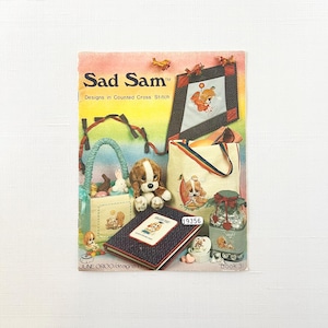 Libro de punto de cruz contado Sad Sam de June Grigg
