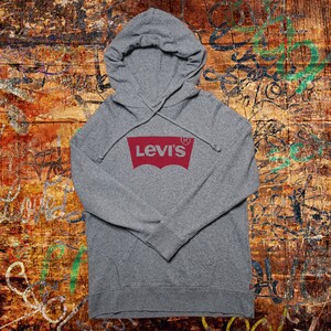 May include: A grey hooded sweatshirt with a red Levi's logo on the front.