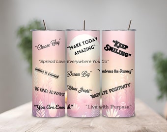 May include: Three pink and white stainless steel tumblers with inspirational quotes. The quotes are "Choose Joy", "Make Today Amazing", and "Keep Smiling".