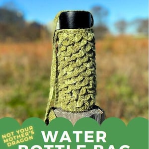 May include: Green crocheted water bottle bag with a strap. The bag is made with a scale pattern. The text "Not Your Mother's Dragon" and "Water Bottle Bag A Crochet Pattern by Molls Made It" is on the image.